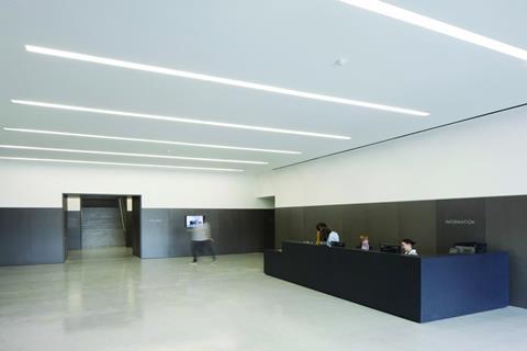 The entrance lobby is lined with dark grey pigmented MDF.